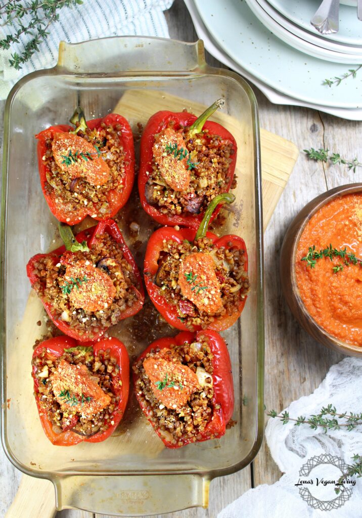 Holiday Stuffed Peppers with Buckwheat, Mushrooms and Sundried Tomatoes, Served with Tomato Sauce. Truly appetizing, beautiful and healthy. Vegan - Gluten Free