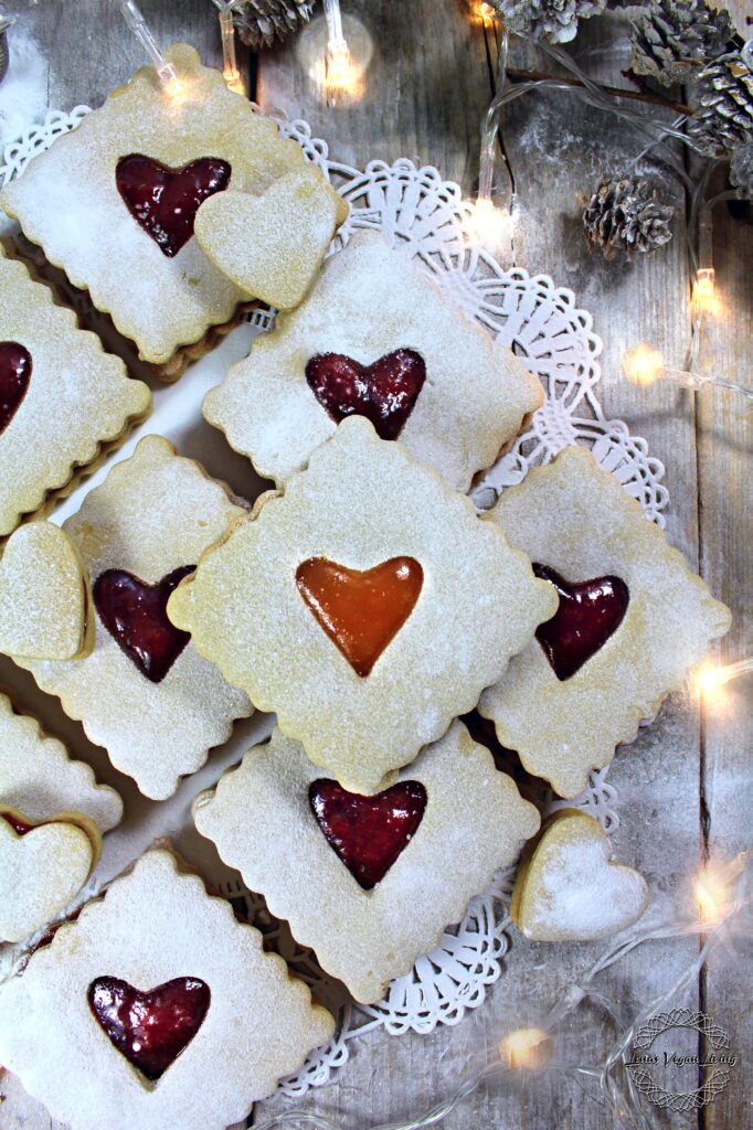 Elevate your holiday baking with a nutritious twist on the classic: Christmas Linzer Cookies. Vegan - Gluten Free - Refined Sugar Free