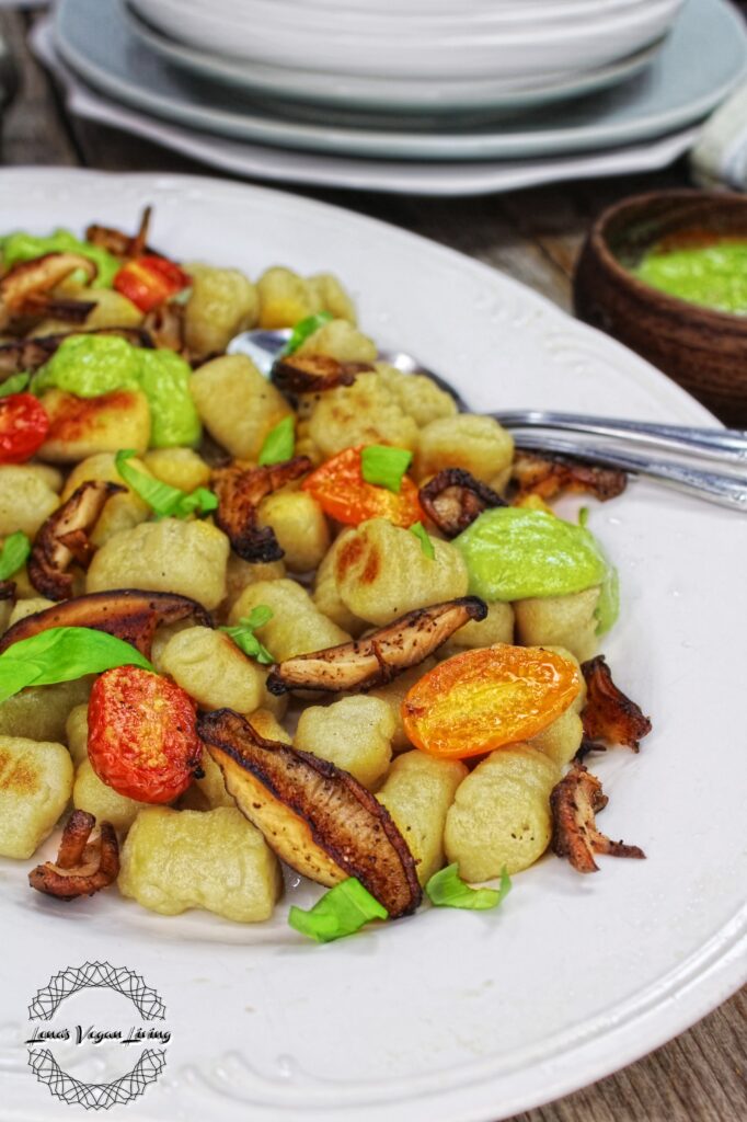 Indulge in the delightful flavors of Autumn Gnocchi with Pesto, a tantalizing and nutritious dish. Vegan - Gluten Free